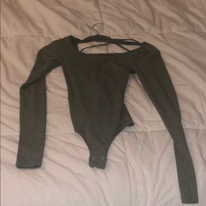 Green garage bodysuit